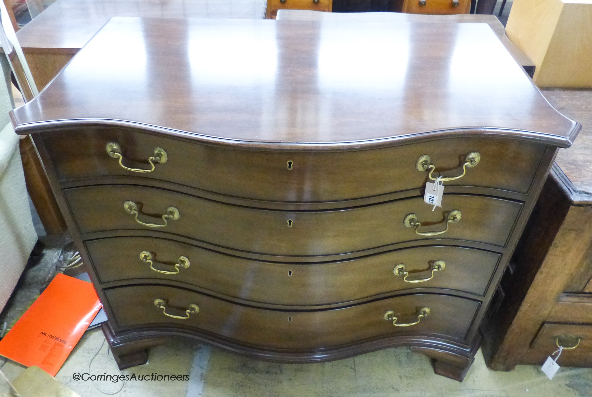 A reproduction George III Kittinger furniture serpentine mahogany chest, width 108, depth 58, height 85cm.